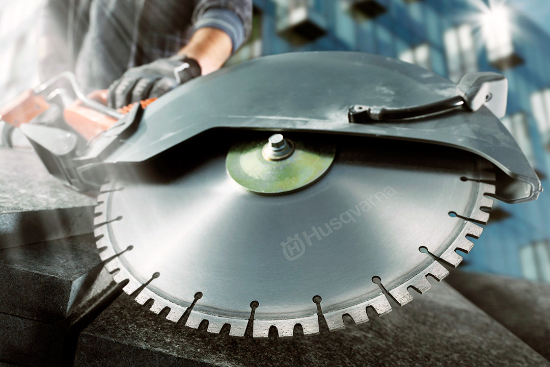 A close-up of a Husqvarna power cutter blade attached to a K4000 power cutter