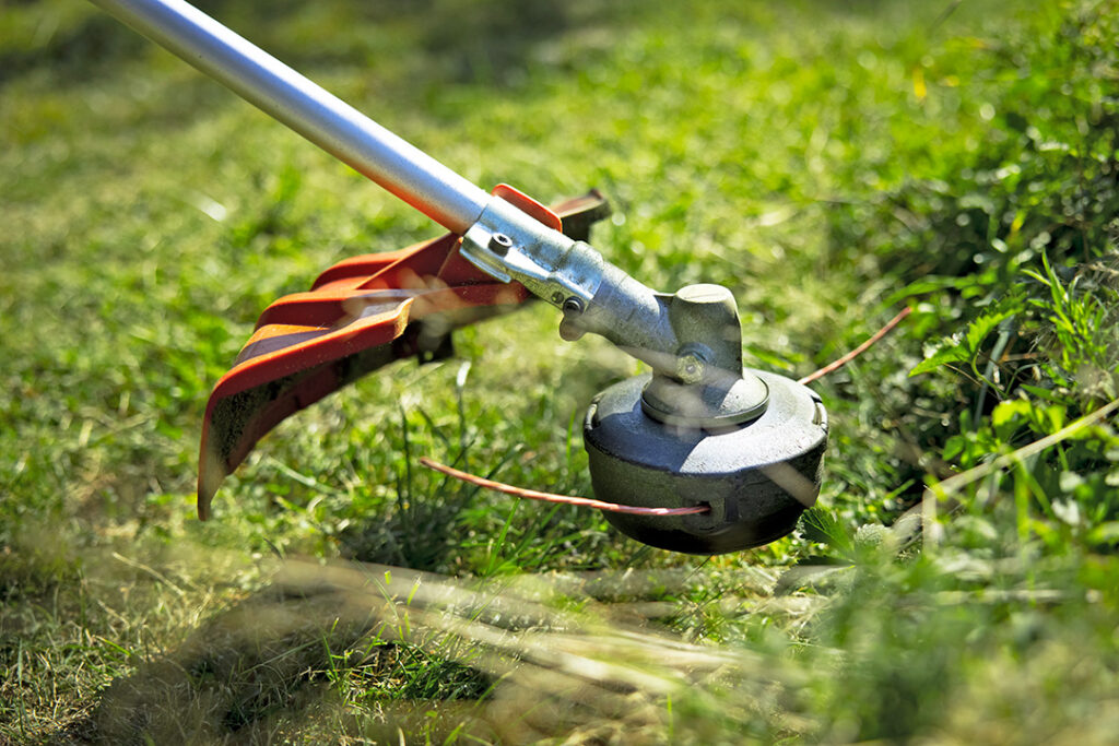 A close-up photo of a Husqvarna brushcutter trimmer head.